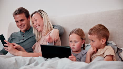 parents, children and tablet in bedroom