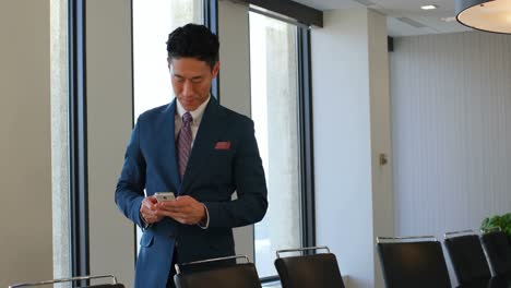 businessman using mobile phone in office 4k