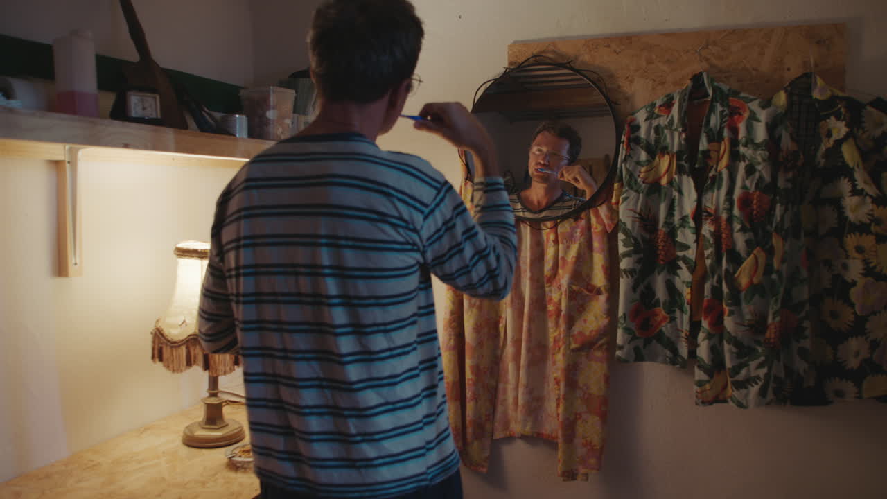Man Brushing Teeth in Small Home