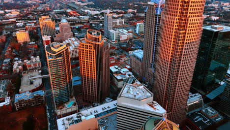 approaching unusual high-rise buildings lit with bright sun. vast cityscape of chicago, illinois, the usa from top