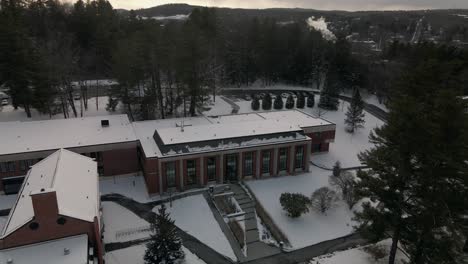 Top-View-Exterior-Of-Bishop's-University-On-Snow-Landscape-During-Winter-In-Lennoxville,-Sherbrooke,-Quebec,-Canada