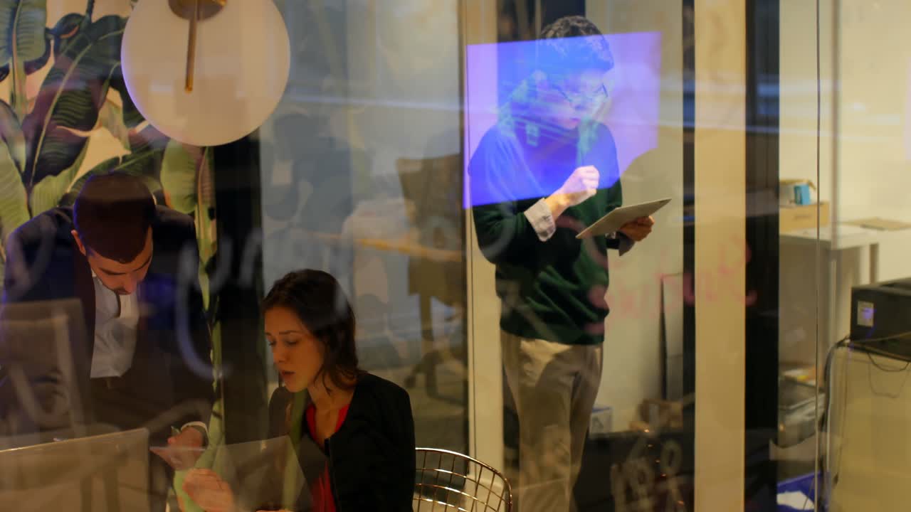 Male executive using digital tablet in office 4k