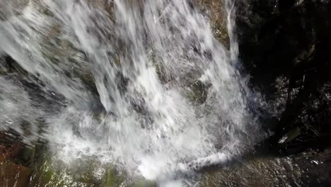 aerial flyover of the crest of a waterfall near boone north carolina