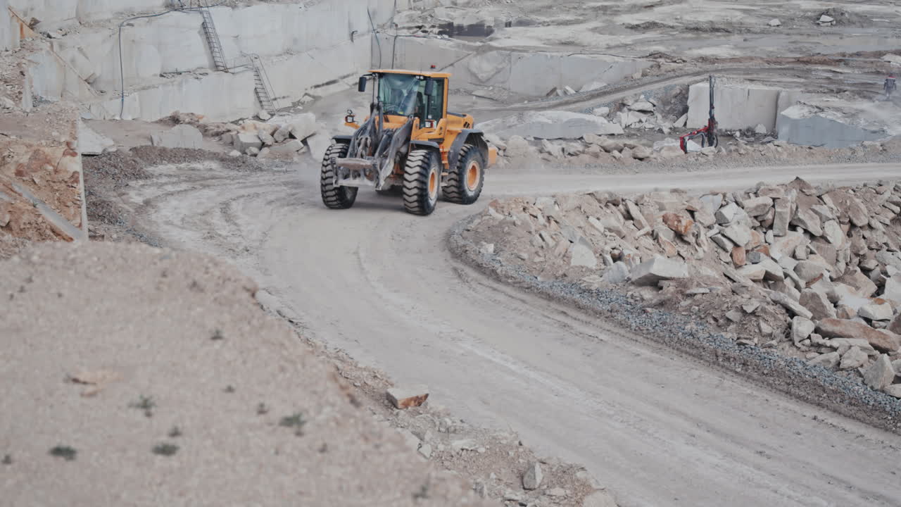 Wheel Loader Driving Along Haul Road in Quarry