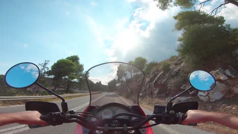 riding a motorcycle on penteli mountain in greece