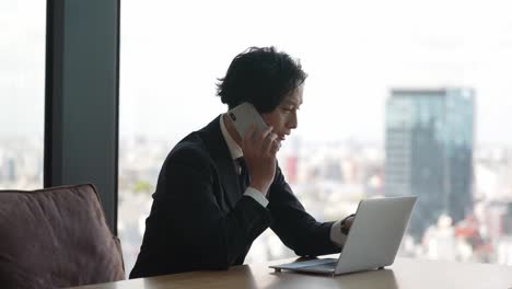 asian businessman using laptop in the office