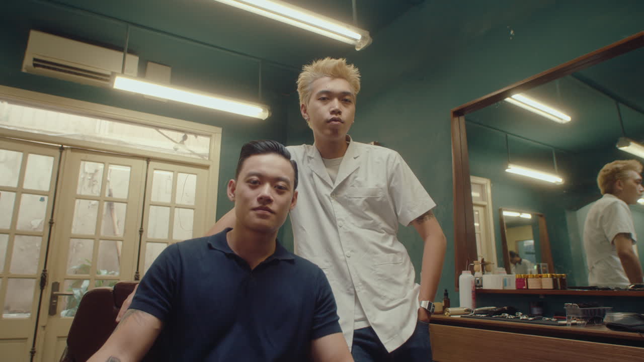 Asian Barber and Male Client Posing in Vintage Barbershop