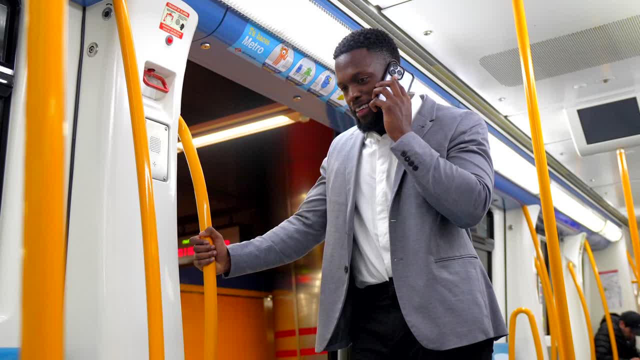 Man Talking on Phone in Subway Train