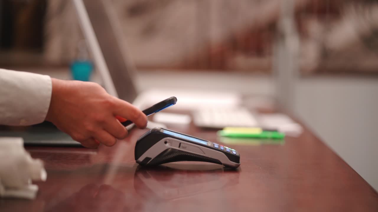 Unrecognizable person making contactless payment