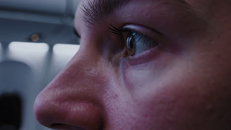 close-up of a person's face in an airplane