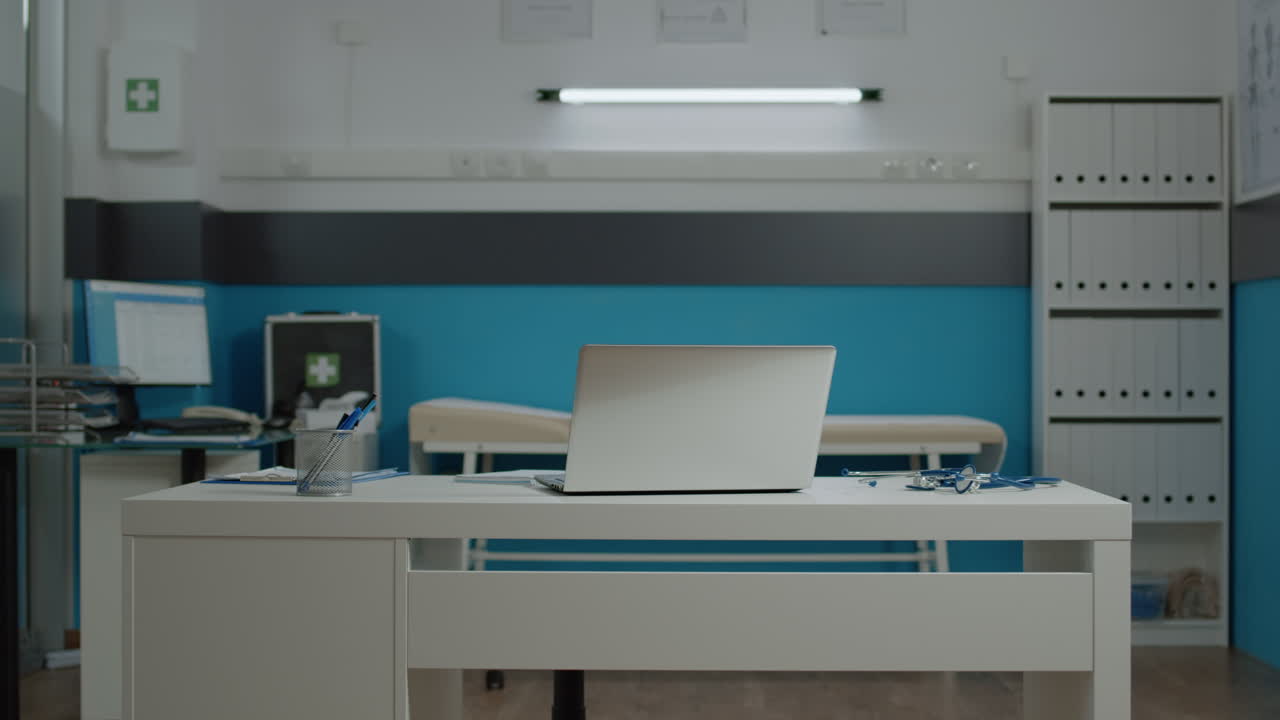 Doctor's office interior with laptop and medical equipment