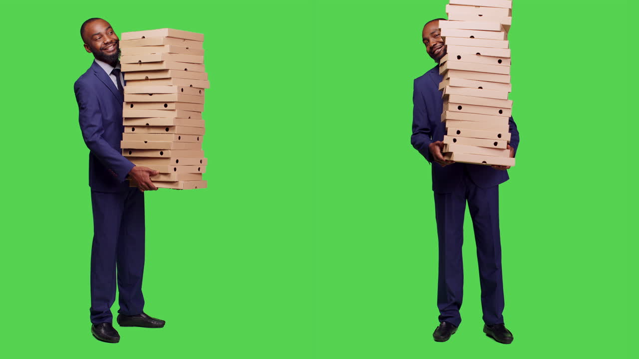 Man Holding Stack of Pizza Boxes