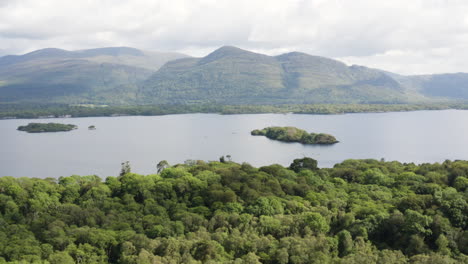 aerial - mountains in killarney national park and muckross lake, ireland, reverse