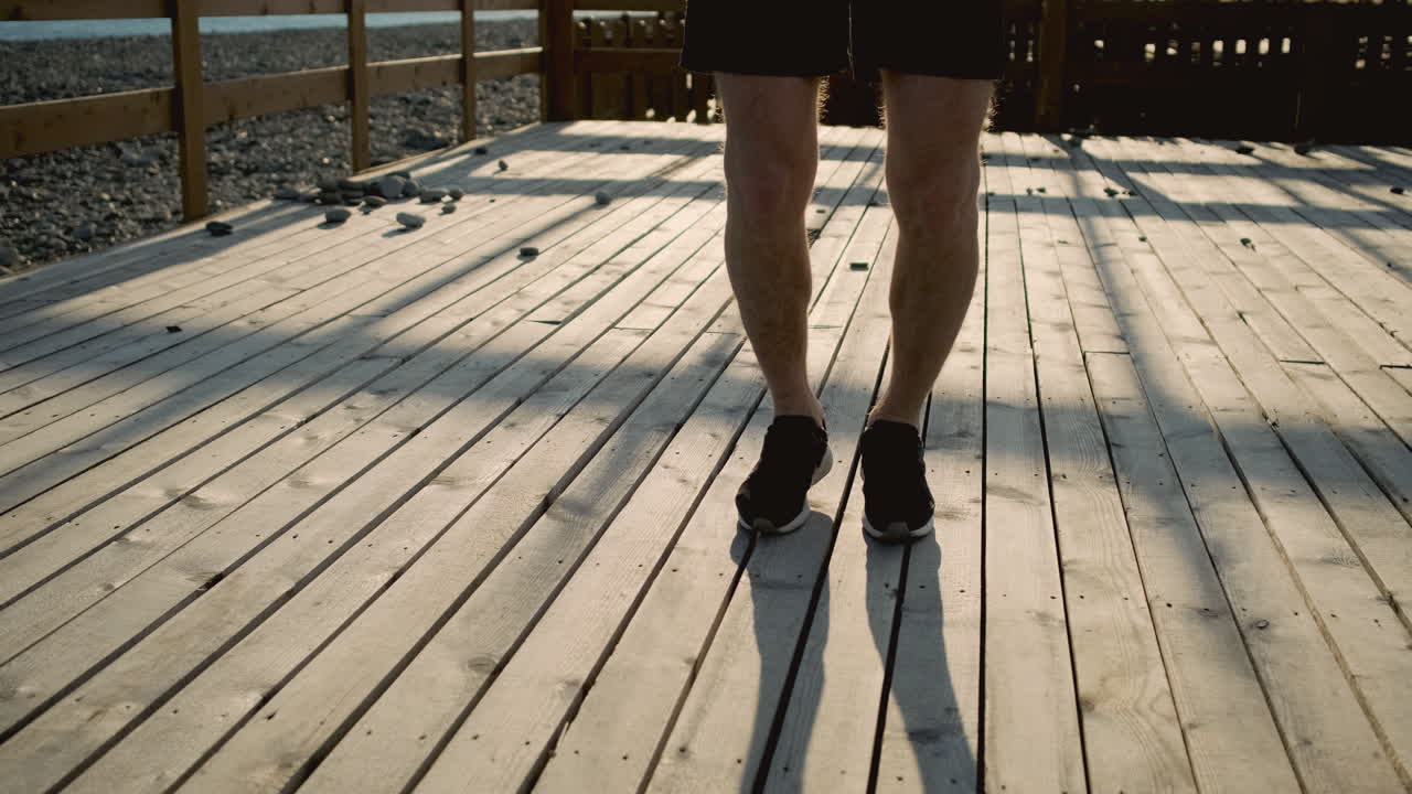 Man Jumping Rope on a Beach Pier