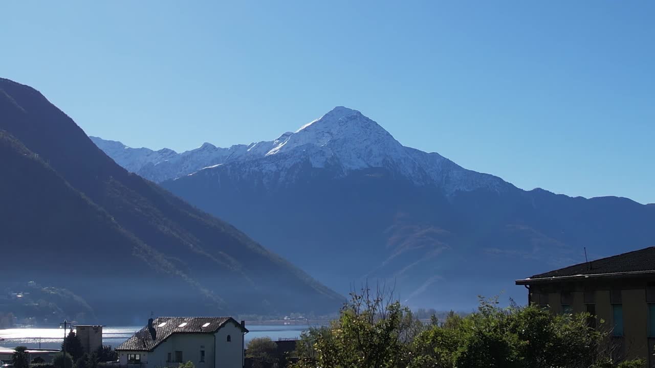 Stunning aerial view of the Italian Alps featuring snow-capped peaks