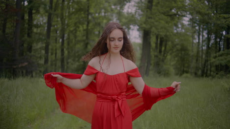 Woman-In-Red-Dress-Walking-In-Forest