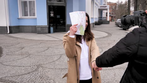 Caucasian-tourist-couple-happily-recording-each-other-on-camera.