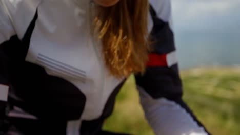 female cyclist checking speed on screen at bicycle 4k