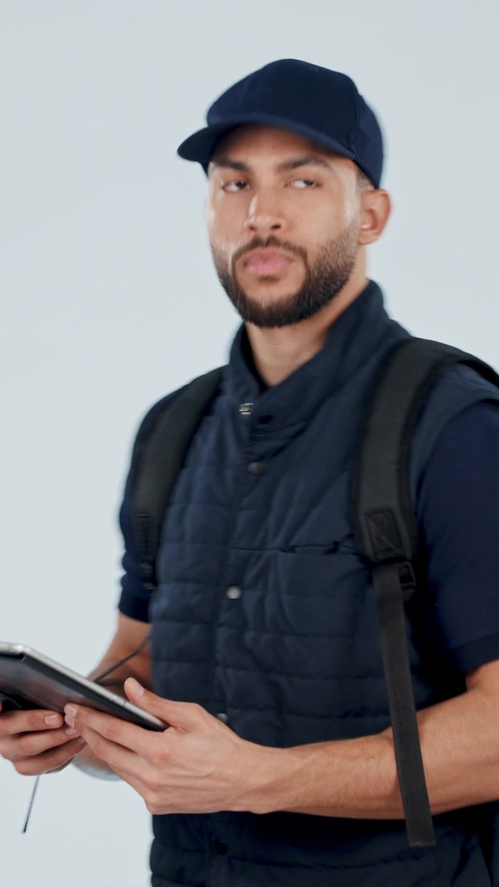 Delivery Driver Using Tablet to Check Order Details