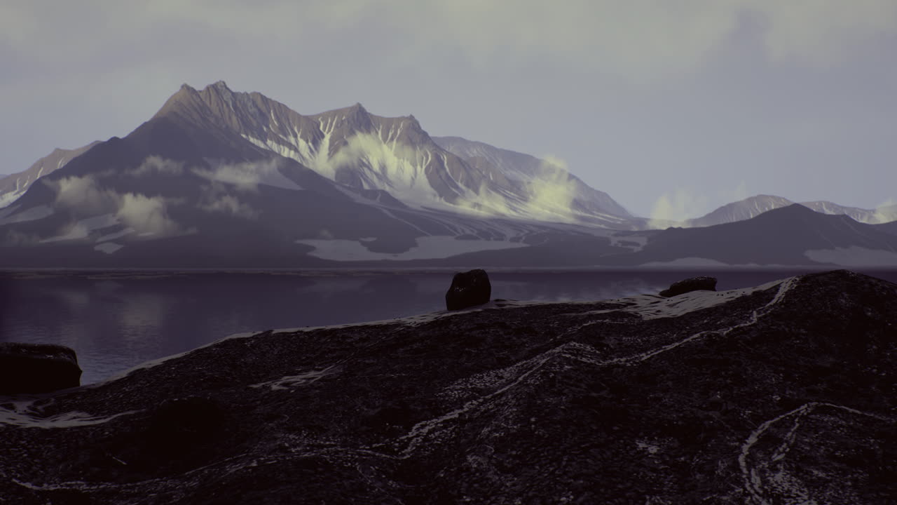 Stunning panoramic view of mountain range reflecting on the calm lake at dusk