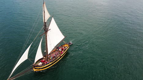 Aerial-circling-view-over-Le-Renard-Robert-Surcouf-wooden-boat-sailing-on-Mediterranean-sea