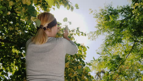 A-Young-Woman-Picks-Flowers-From-The-Branches-Of-Her-Face---A-Collection-Of-Useful-And-Medicinal-Pla