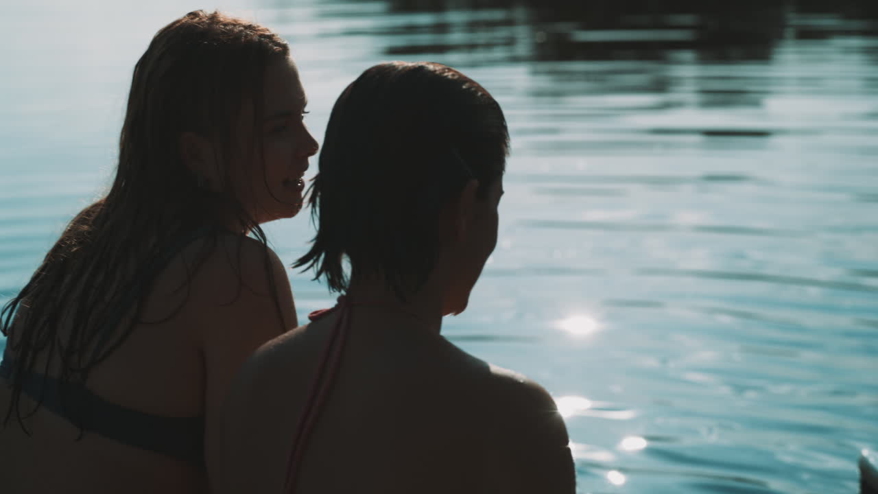 Two Women Relaxing by the Lake