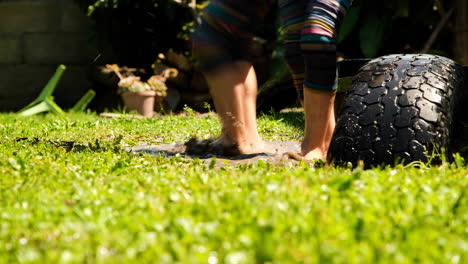 siblings splash into mud puddle together, joys of childhood, low-angle