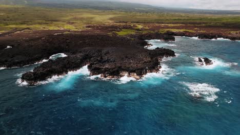 scenic view of lava rocks by the shore of big island hawaii