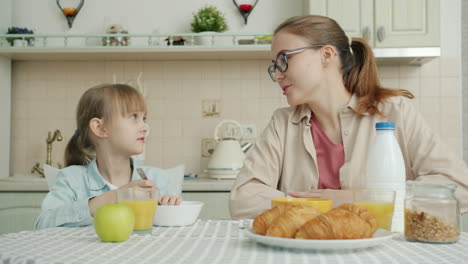 mother and daughter enjoying breakfast