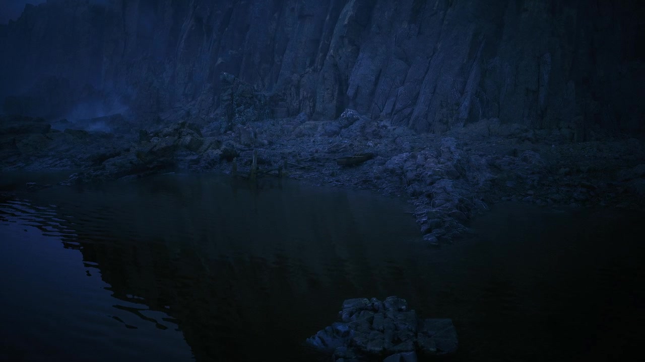 Peaceful twilight image featuring calm water and scattered rocks