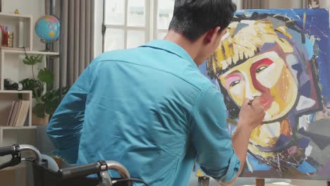 artist painting a portrait in a home studio