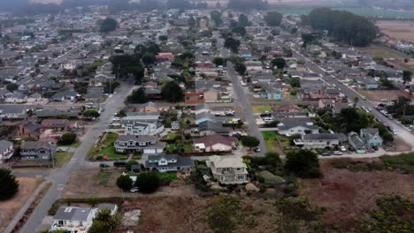 aerial: half moon bay beach neighborhood. flying forward