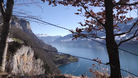 wide panorama shot of o fjord lake in switzerland surrounded by cliffs