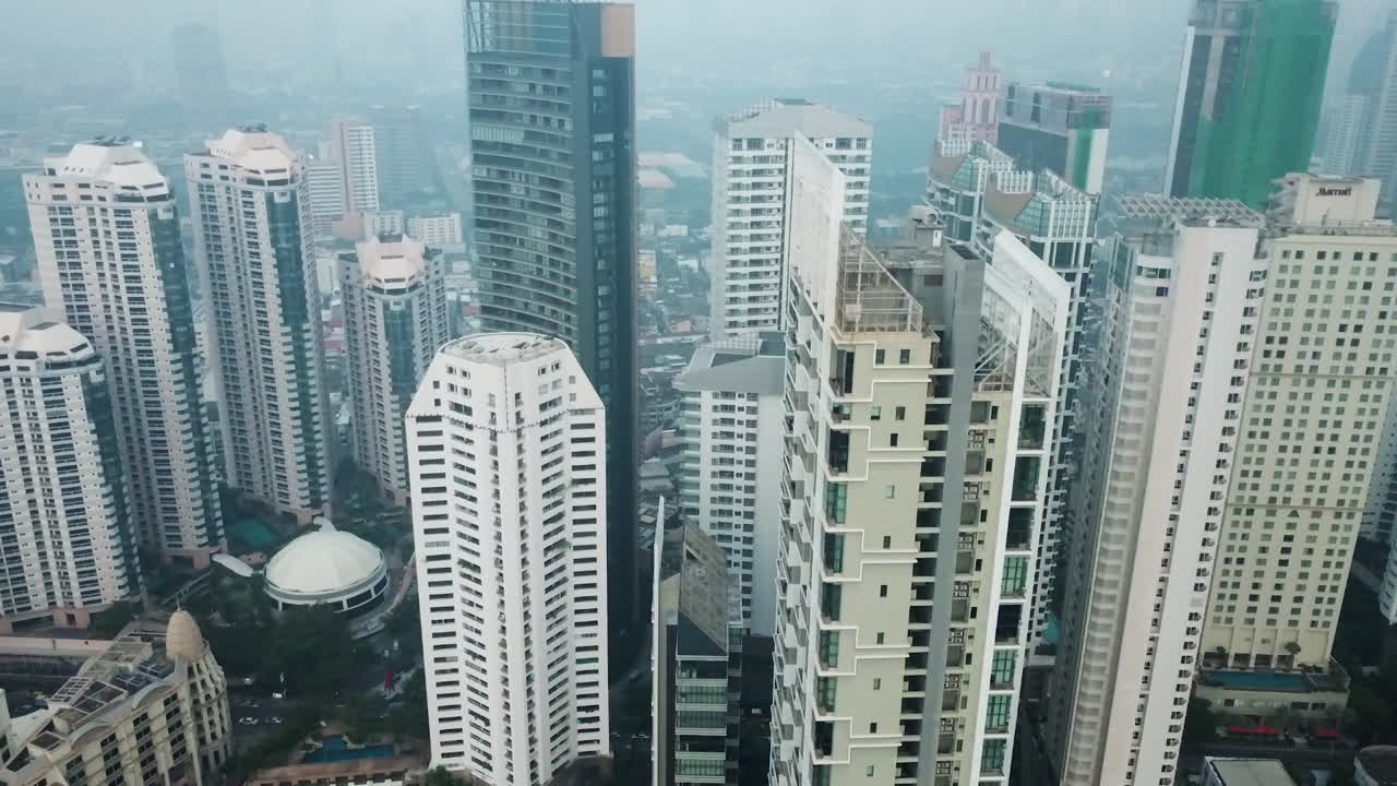 Aerial View of Bangkok Thailand, Skyscrapers Under Heavy Air Pollution