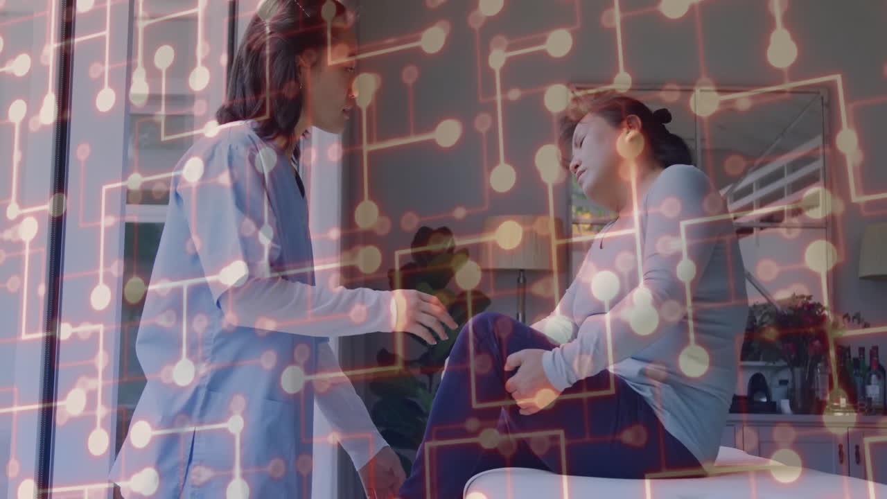 nurse kneeling beside patient on couch, showing glowing circuit overlay for medical technology