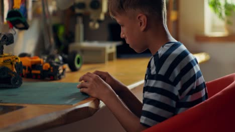 boy building a robot toy