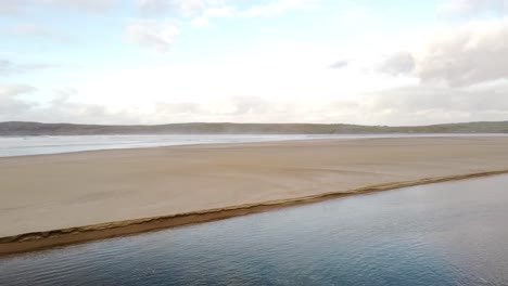 aerial footage of a beach on a sunny day in donegal, ireland