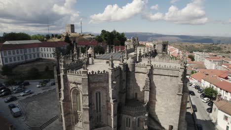 heritage landmark in portugal, guarda catholic church close up, aerial view of the rooftop