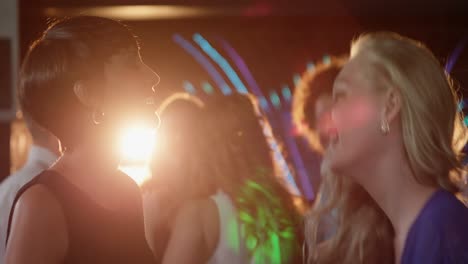 two beautiful women dancing on dance floor