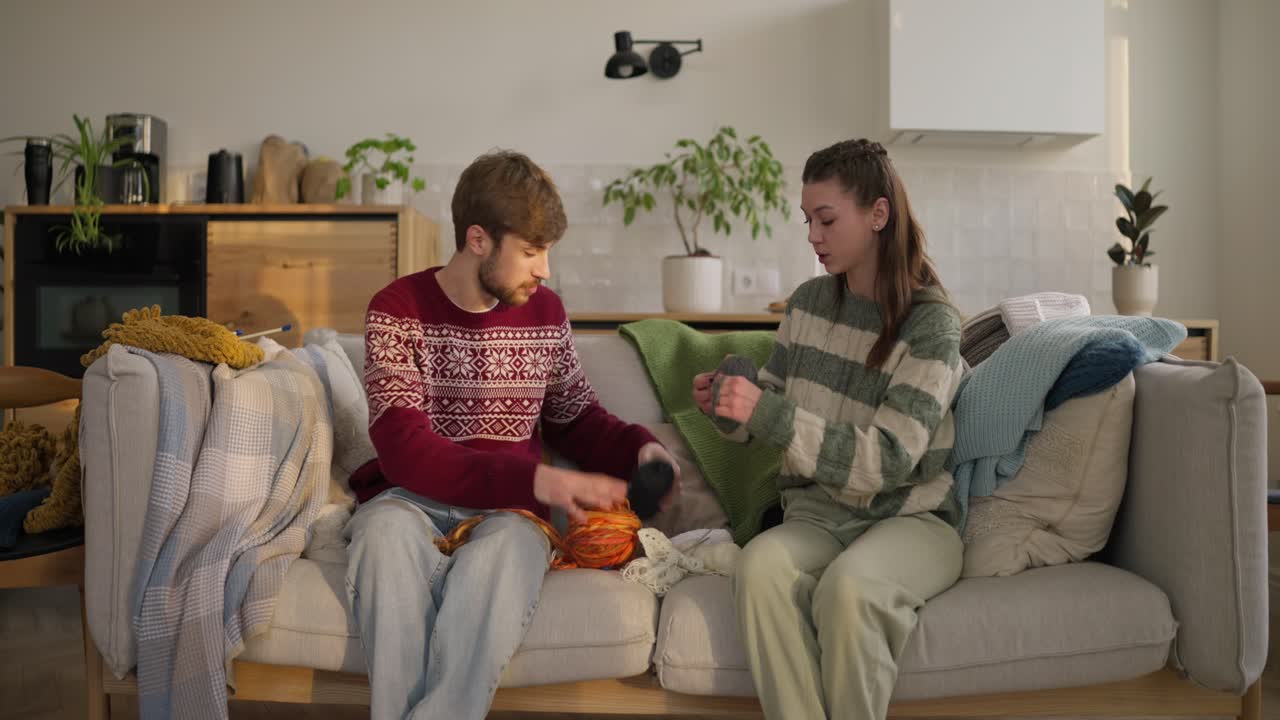 Couple Knitting Together at Home
