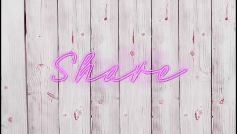 animation of illuminated pink share text over wooden background