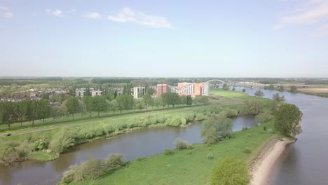 Aerial-view-of-the-suburban-near-the-big-lake-full-of-apartment-and-houses