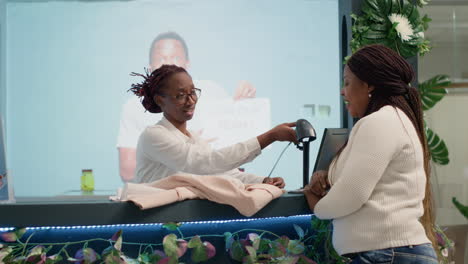 woman scanning customer products