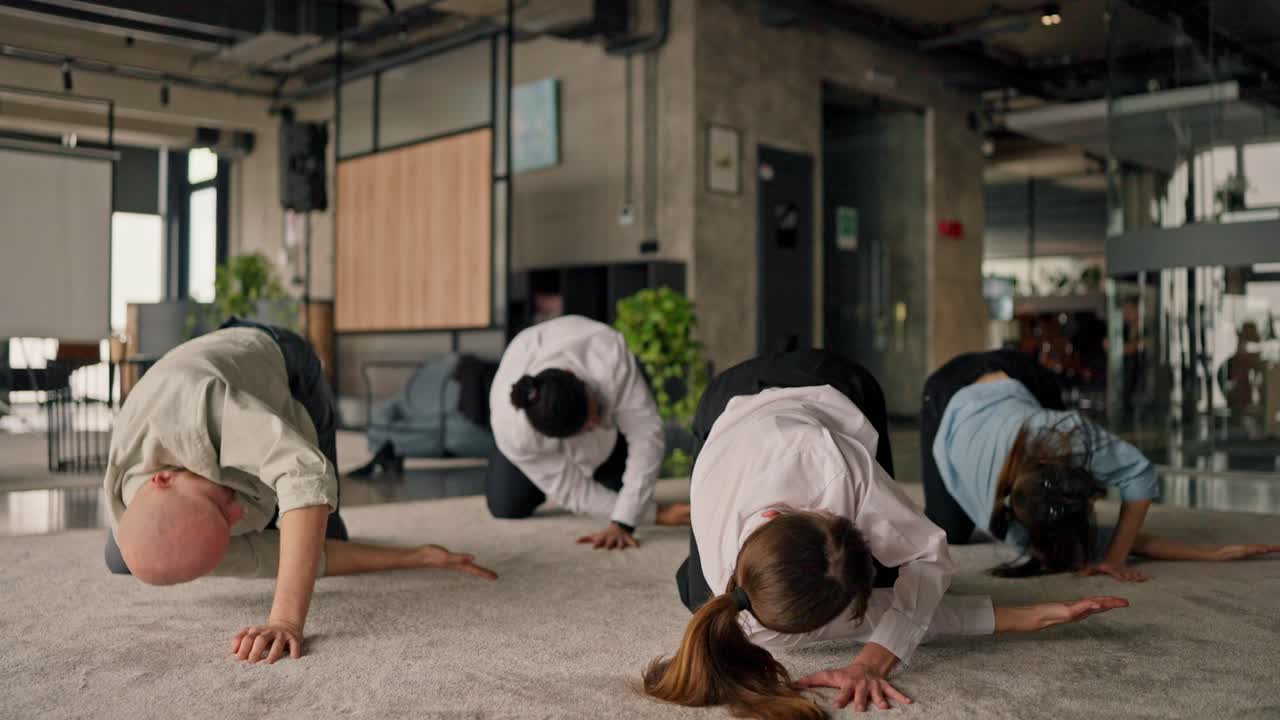 Team stretching session in the office