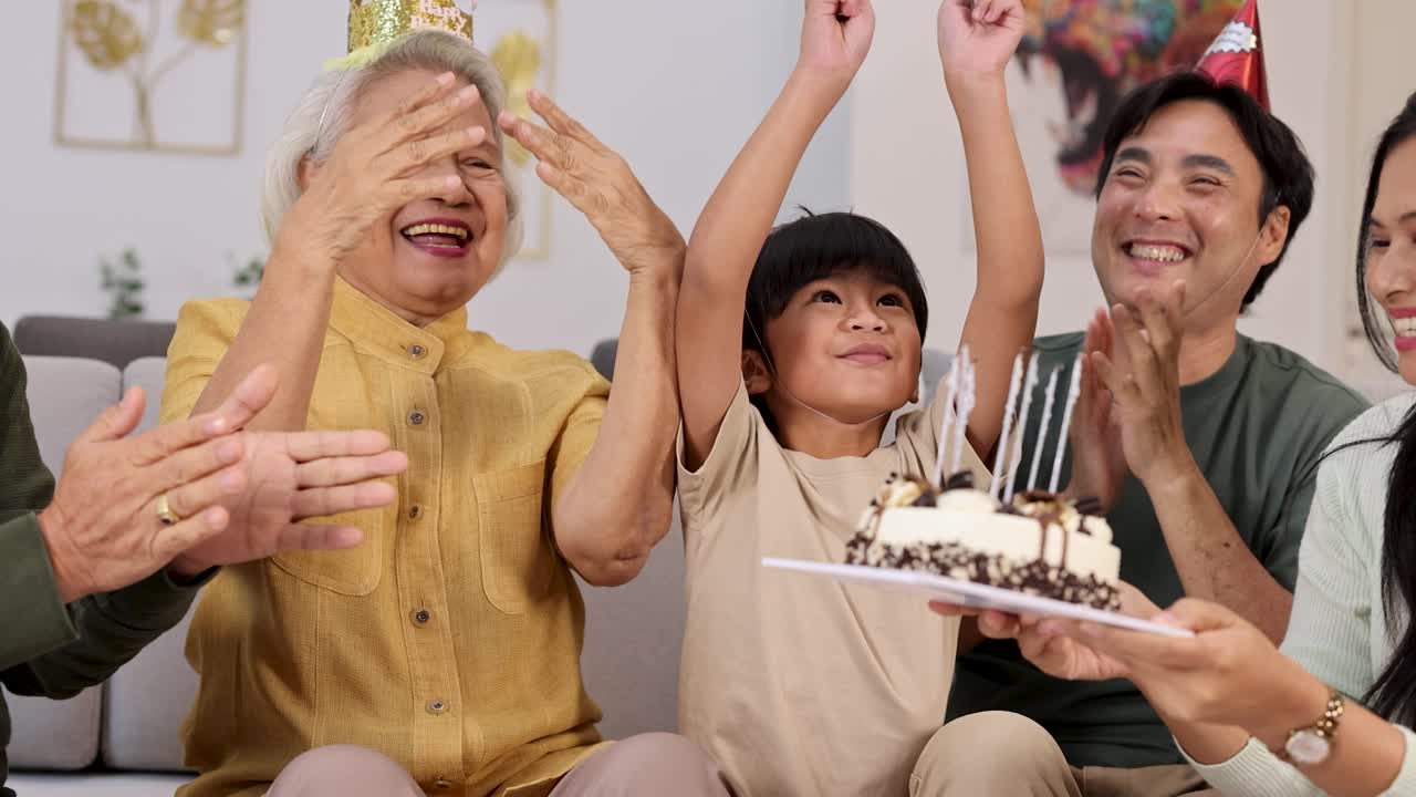 A joyful family birthday celebration with cake, candles, and laughter in a cozy home setting