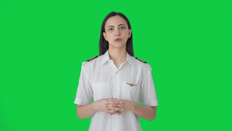 Indian-woman-pilot-talking-to-someone-Green-screen