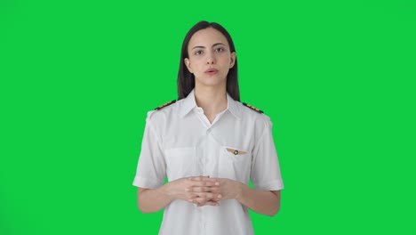 indian woman pilot talking to someone green screen