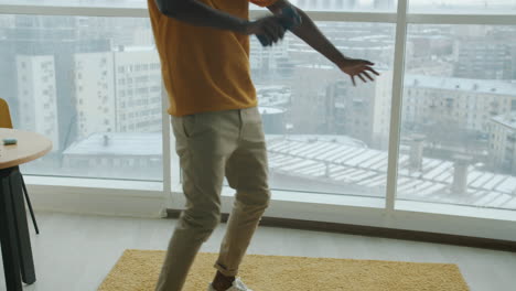 man dancing in a modern apartment