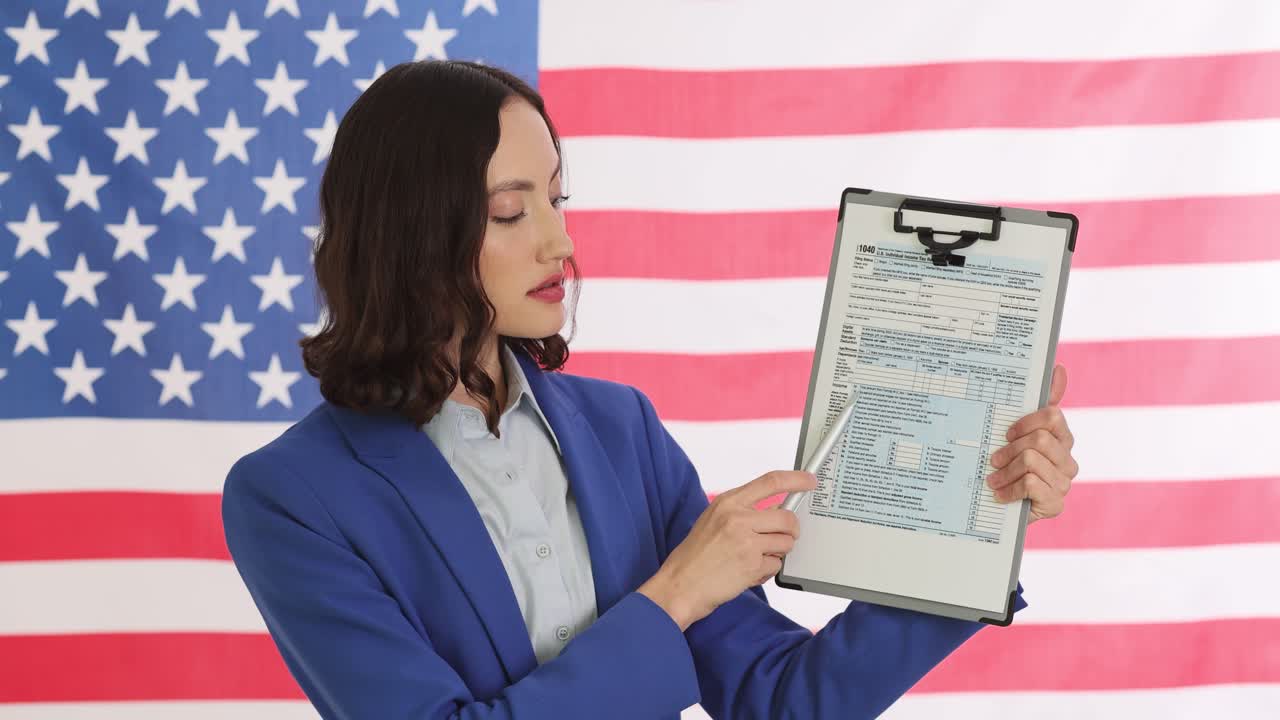 Woman holding a 1040 tax form in front of an American flag